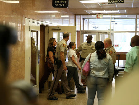 Tulsa police officer Betty Shelby arrives for her arraignment after she was charged with manslaughter in the death of Terence Crutcher, at Tulsa County Courthouse in Tulsa, Oklahoma, U.S. September 30, 2016. REUTERS/Richard Rowe