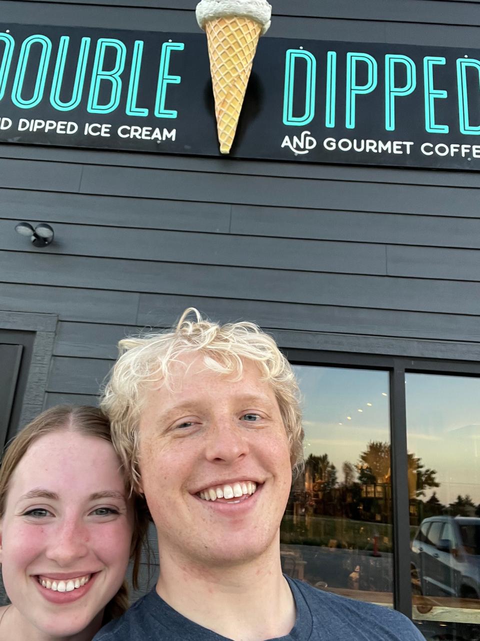 James Douthit and his girlfriend Abby Fowler, both of Ames, pose in front of Double Dipped Ice Cream in Huxley. They both bicycled to the ice cream shop.