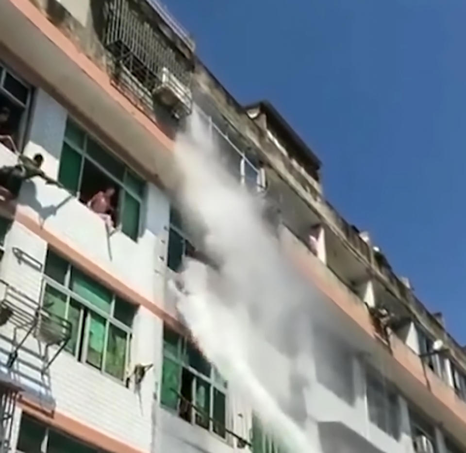 The woman had threatened to throw herself from her third-floor window (AsiaWire)