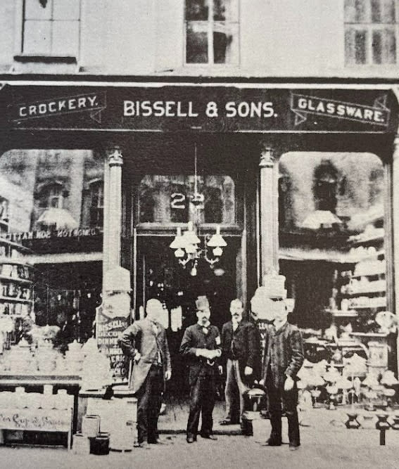 Melville Bissell poses outside of his crockery shop in downtown Grand Rapids.