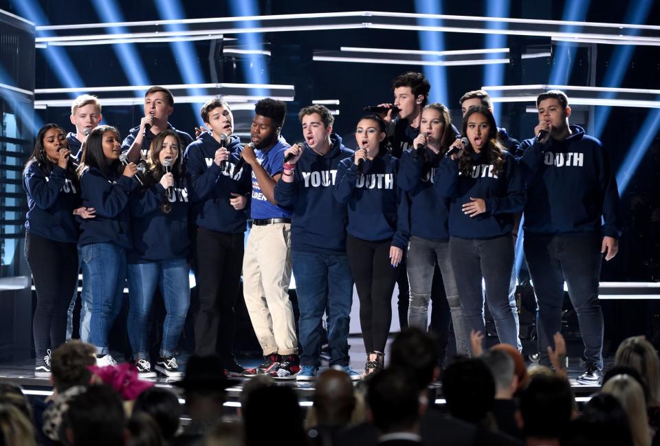 Khalid, seventh from left, and Shawn Mendes, fifth from right, perform