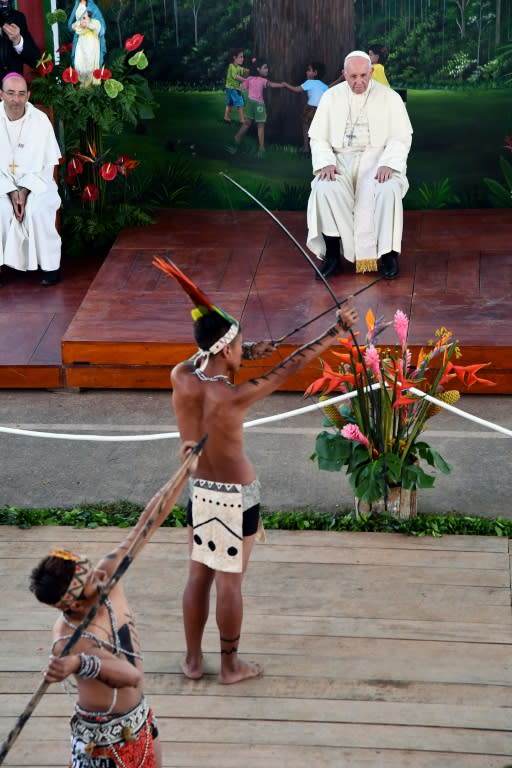 Pope Francis watches a performance by indigenous boys during his visit to the Hogar Principito children's home