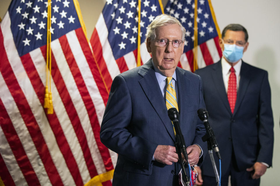 Senate Majority Leader Mitch McConnell, R-Ky., with Sen. John Barrasso, R-Wyo., speaks to reporters following a GOP policy meeting on Capitol Hill, Tuesday, June 30, 2020, in Washington. (AP Photo/Manuel Balce Ceneta)