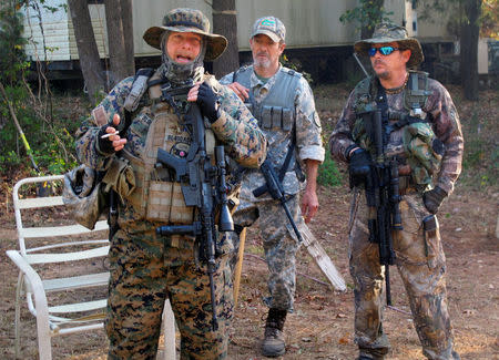 Chris Hill (L), the leader of the Georgia Chapter of the III% Security Force militia, speaks to members during a field training exercise in Jackson, Georgia, U.S. October 29, 2016. REUTERS/Justin Mitchell