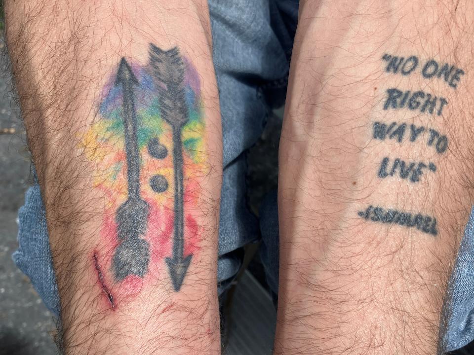 Ronald North has a tattoo on each of his arms to help remind him of his struggle. On the left is one of his late partner's favorite quotes and the other is one North designed to remind him to keep moving forward.