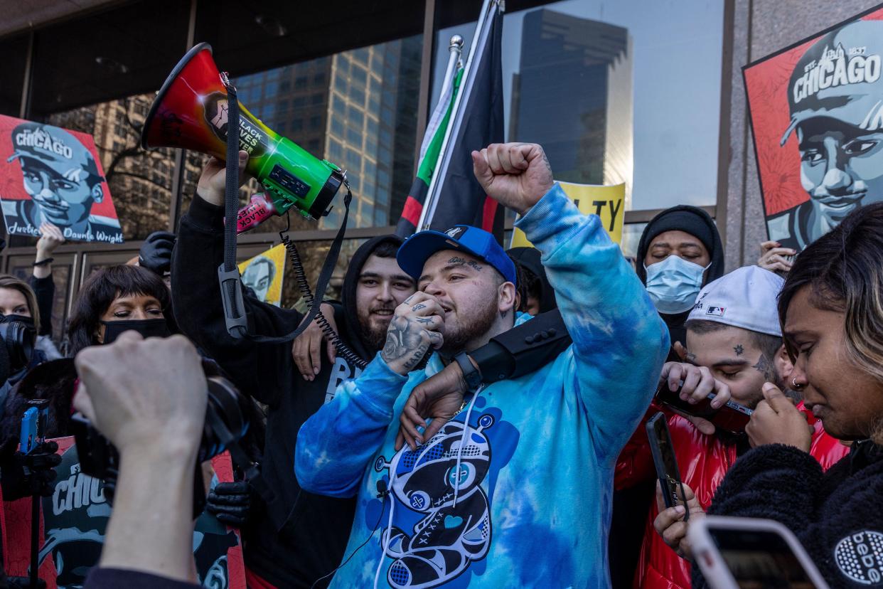 Damik Wright (C), brother of Daunte Wright, celebrates at George Floyd Square after the verdict was announced in the trial of former police officer Kim Potter in Minneapolis, Minnesota on December 23, 2021. Potter, 49, was found guilty on Dec. 23, 2021, of two counts of manslaughter in the fatal shooting of Daunte Wright, 20, in Brooklyn Center, a suburb of Minneapolis, Minnesota, on April 11, 2021.