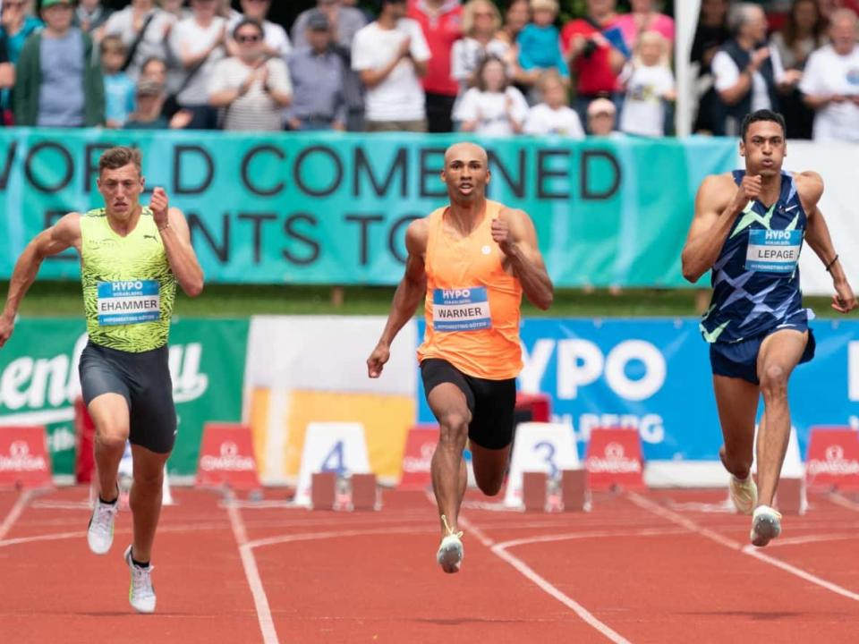 Switzerland's Simon Ehammer, Canada's Damian Warner and Canada's Pierce Lepage compete in the men's 100m at the Hypo Meeting in the traditional track and field decathlon on May 28, 2022 in Goetzis, Austria. (Dietmar Stiplovsek/APA/AFP via Getty Images - image credit)