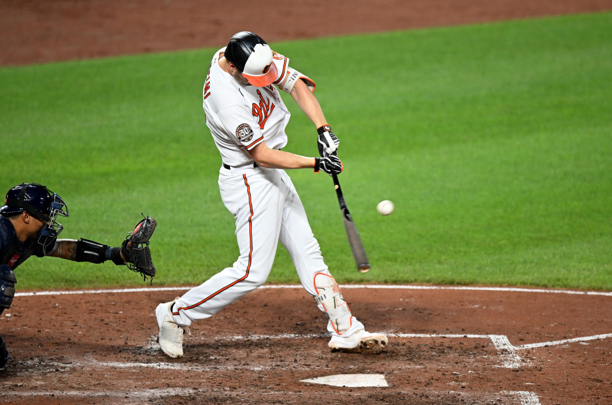 BALTIMORE, MARYLAND - JULY 27: Trey Mancini #16 of the Baltimore Orioles hits a single in the fifth inning against the Tampa Bay Rays at Oriole Park at Camden Yards on July 27, 2022 in Baltimore, Maryland. (Photo by Greg Fiume/Getty Images)