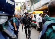 Security personnel leave the site after police operation on militants, on the outskirts of Dhaka, Bangladesh, July 26, 2016. REUTERS/Mohammad Ponir Hossain