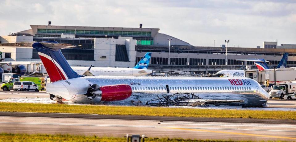 A Red Air plane that caught on fire after the landing gear “collapsed” sits on the runway. The flight was coming from Las Américas International Airport in the Dominican Republic on Tuesday, June 21, 2022.