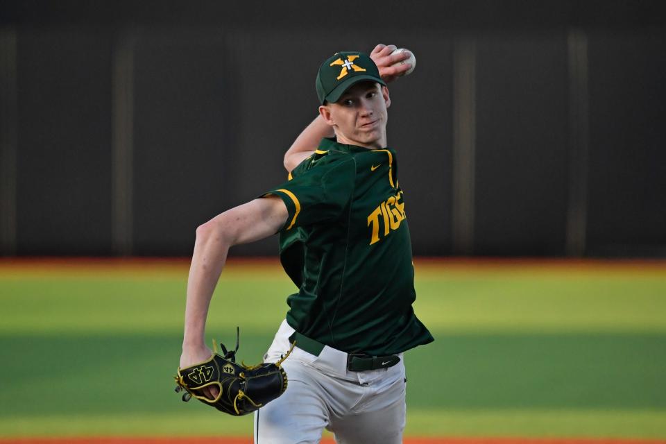 St. Xavier's Ty Starke (18) pitches during Seventh Region championship baseball game on May 29 2022.