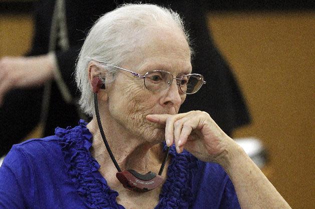 Alice Uden listens to the judge during jury selection at the Laramie County District Court on Tuesday, April 29, 2014. Uden faces one count of first-degree murder for allegedly killing her husband nearly 40 years ago. (AP Photo/The Wyoming Tribune Eagle, Miranda Grubbs)