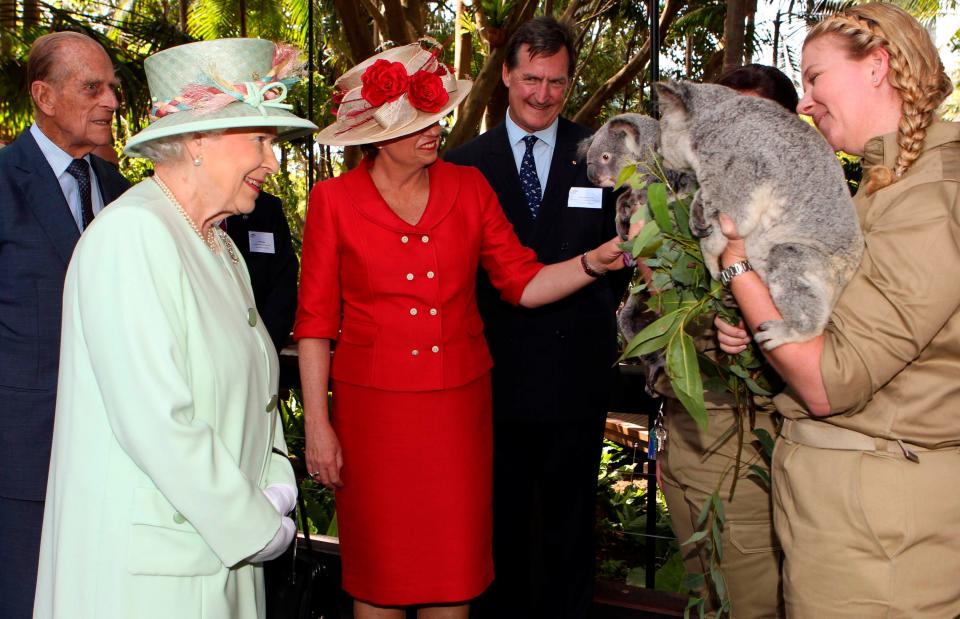 Queen Elizabeth meets a koala in Australia in 2011.