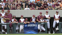 The Virginia Tech bench looks on during an NCAA college baseball super regional game against Oklahoma in Blacksburg, Va., Friday, June 10, 2022. (AP Photo/Matt Gentry)