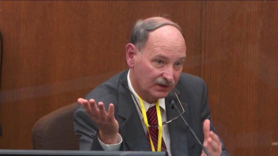 In this image taken from video witness Dr. Bill Smock, a Louisville physician in forensic medicine testifies as Hennepin County Judge Peter Cahill presides Thursday, April 8, 2021, in the trial of former Minneapolis police Officer Derek Chauvin at the Hennepin County Courthouse in Minneapolis, Minn.