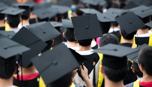 back of graduates during commencement.