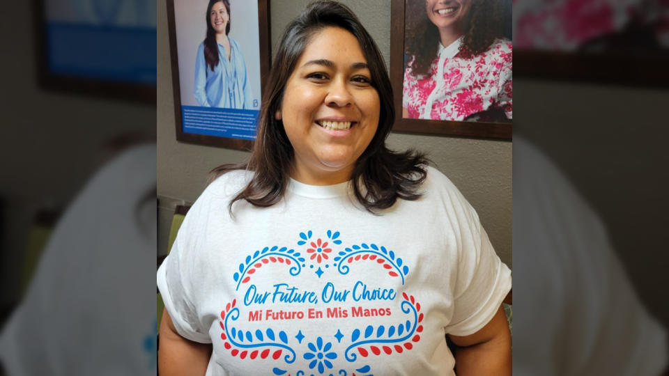 Miranda Aguirre, wearing a T-shirt that reads, in English and Spanish: Our future, our choice.