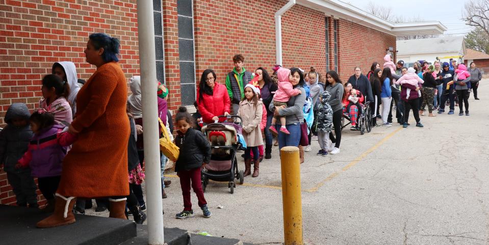 Families line up to attend the 2019 Christmas in the Hood Block Party hosted by the Oklahoma City Dream Center in south Oklahoma City.