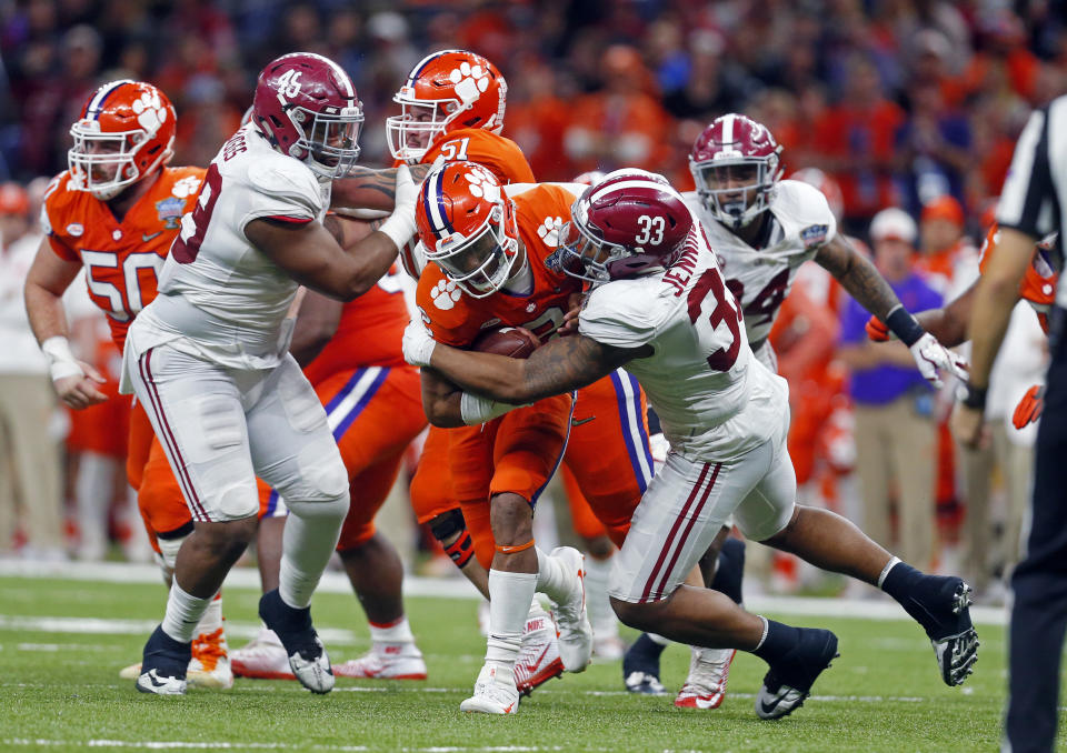 Clemson quarterback Kelly Bryant (2) is brought down by Alabama linebacker Anfernee Jennings (33) in the second half of the Sugar Bowl semi-final playoff game for the NCAA college football national championship, in New Orleans, Monday, Jan. 1, 2018. (AP Photo/Butch Dill)