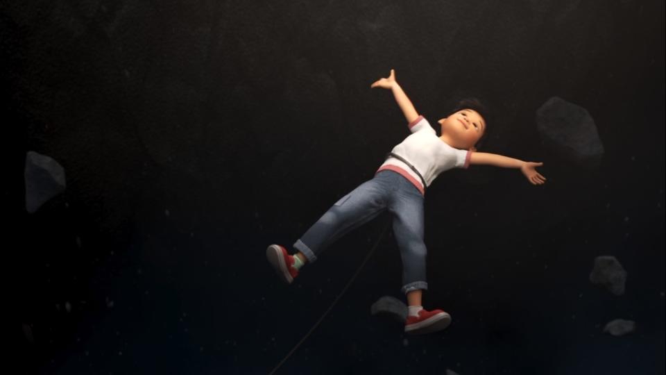 A boy floats through space