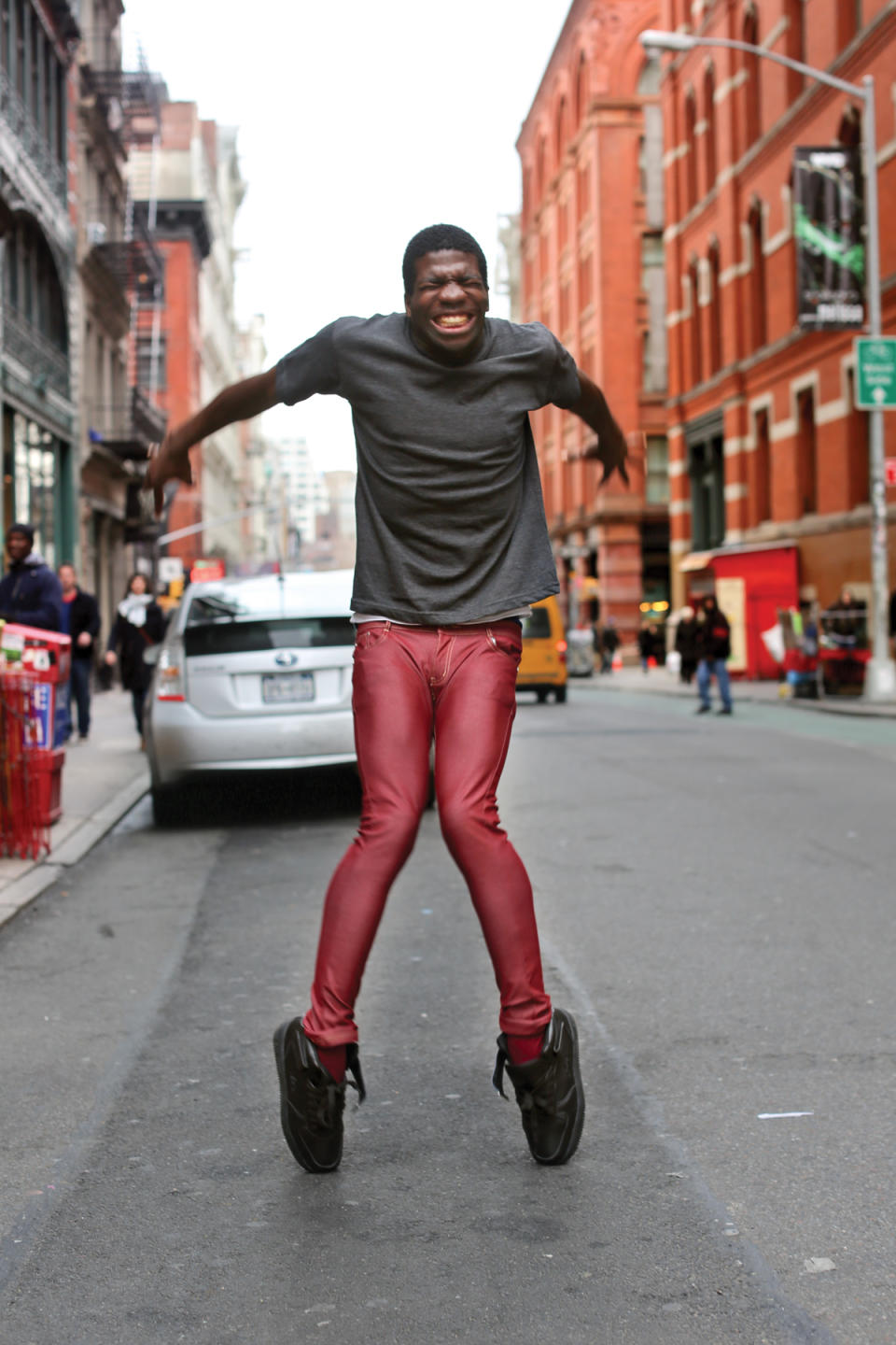This image released by St. Martin's Press shows a man, who was dancing for tips, in New York. The image is one of many by photographer Brandon Stanton, creator of the blog and book titled, "Humans of New York." Stanton’s magical blend of portraits and poignant, pithy storytelling has earned HONY more than 2 million followers online. His book will be released on Oct. 15. (AP Photo/St. Martin's Press, Brandon Stanton)