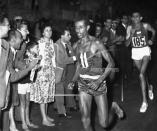 <p>Ethiopian long-distance runner Abebe Bikila was the first East African to win an Olympic medal, but that wasn’t his most memorable moment of the 1960 Rome Games marathon. He won the race barefoot. (AP) </p>