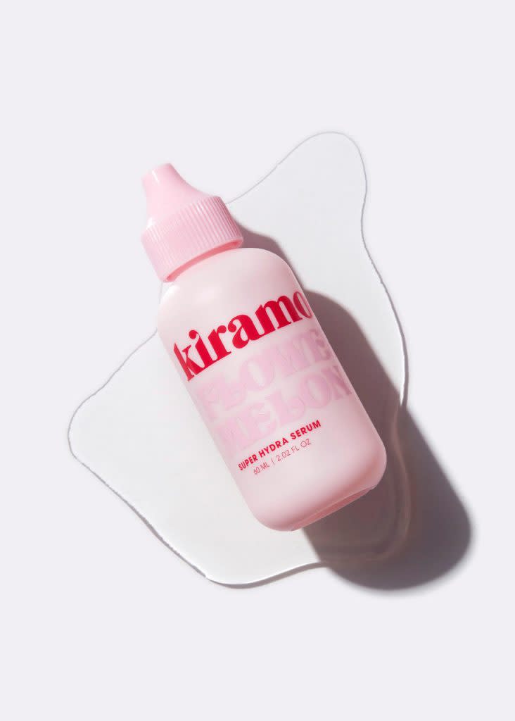 a small pink bottle on top of a serum 