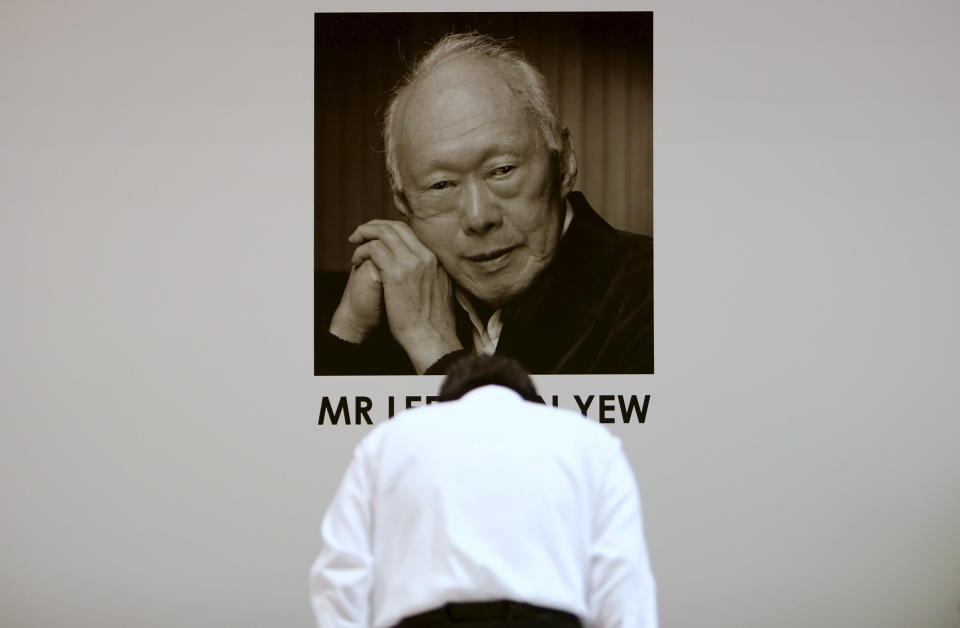 A man bows as he pays his respects to late former prime minister Lee Kuan Yew at Tanjong Pagar community club, in the constituency which Lee represented as Member of Parliament since 1955, in Singapore March 23, 2015. Lee, Singapore's first prime minister, died on Monday aged 91, triggering a flood of tributes to the man who oversaw the tiny city-state's rapid rise from a British colonial backwater to a global trade and financial centre. REUTERS/Edgar Su