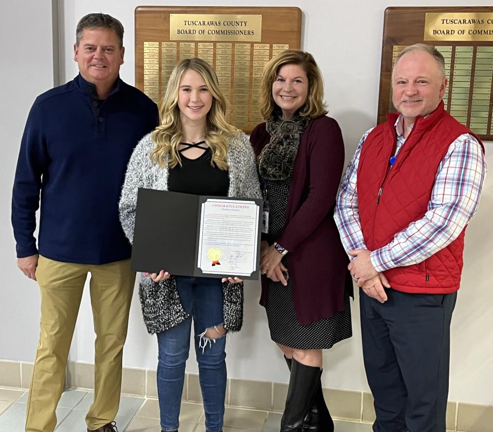 Madison Harmon, 15, of Dennison, was honored by commissioners for placing third in the 2023 Grand National Cross-Country Girls Supermini Championship. She is shown with Commissioners Greg Ress, Kristin Zemis and Chris Abbuhl, from left.