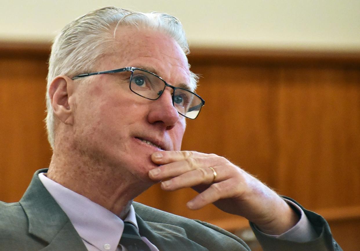 Assistant District Attorney Dennis Collins looks at evidence during the Nelson Coelho trial, accused of murder, on Thursday, May 2, 2024.
