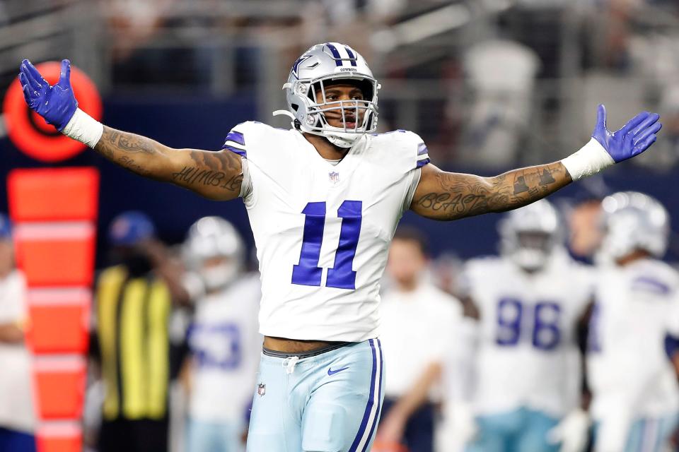 Micah Parsons #11 of the Dallas Cowboys celebrates after a sack during the second half against the Washington Football Team at AT&T Stadium on December 26, 2021 in Arlington, Texas.