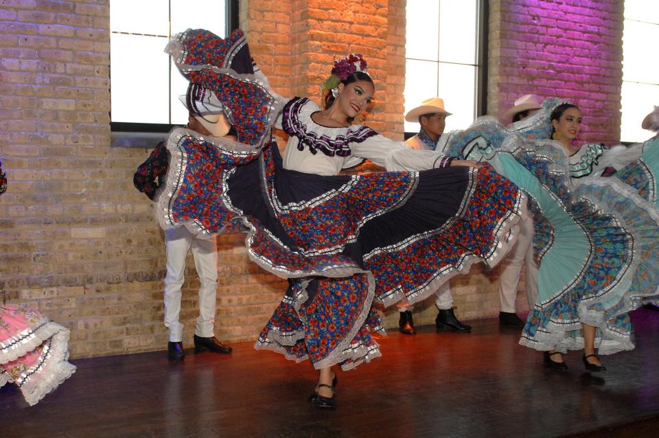 A dancer from the Instituto Cultural de Manuel Gaona performs for guests at the Lubar Center's Latino Heritage Dinner on Sept. 18, 2023.