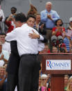 Republican U.S. Presidential candidate Mitt Romney (R) hugs U.S. Congressman Paul Ryan (R-WI) after Romney announced him as his vice-presidential running mate during a campaign event at the retired battleship USS Wisconsin in Norfolk, Virginia, August 11, 2012. REUTERS/Jason Reed