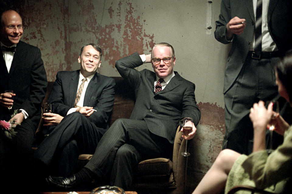 Philip Seymour Hoffman sits with Bob Balaban and Bruce Greenwood