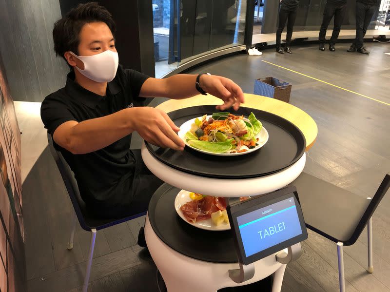 SoftBank's robotics arm demonstrates a food service robot Servi, developed for restaurants grapple with labour shortages and seek to ensure social distancing during the coronavirus disease (COVID-19) outbreak, in T