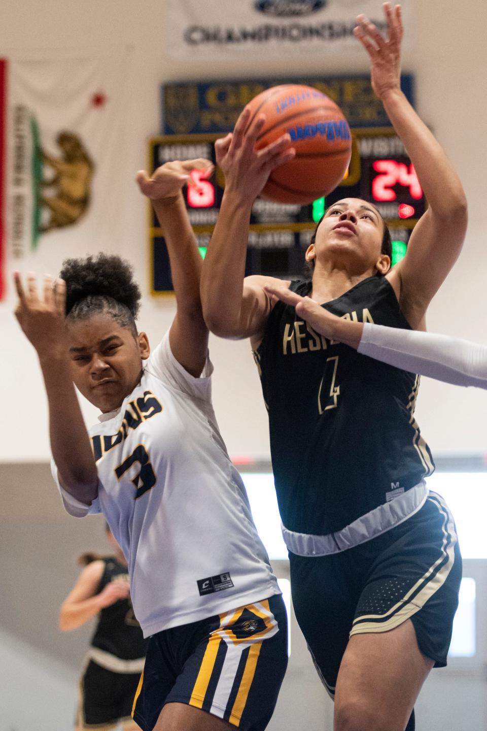 Hesperia’s Kylee Edgar, right, drives the lane against Carter during the Serrano Holiday Classic in Phelan on Wednesday, Dec. 29, 2021. Edgar was named the tournament's most valuable player.