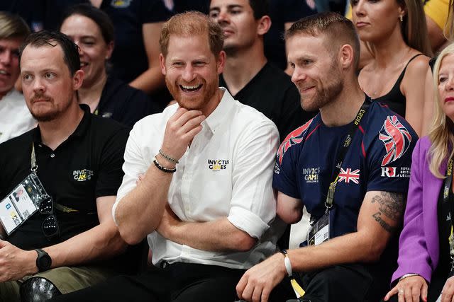 <p>Jordan Pettitt/PA Images via Getty</p> Prince Harry watches the wheelchair rugby finals at the Merkur Spiel-Arena during the Invictus Games in Dusseldorf, Germany