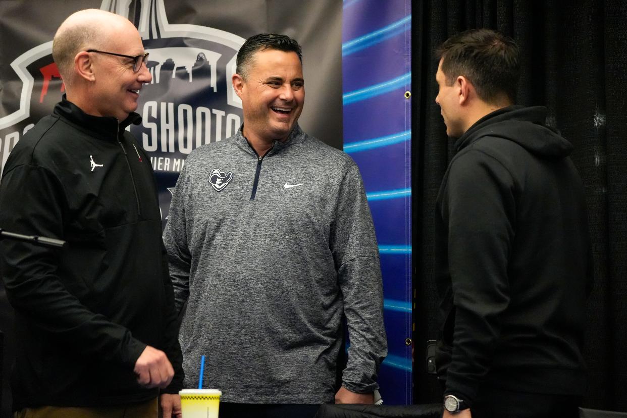 From left: Cincinnati Bearcats commentator Dan Hoard, Xavier Musketeers head coach Sean Miller and Cincinnati Bearcats head coach Wes Miller share a laugh on stage after the Skyline Chili’s Crosstown Shootout Party on Thursday, Dec. 7, 2023, at Skyline Chili in Downtown Cincinnati. Xavier won the game that Saturday at Cintas Center.