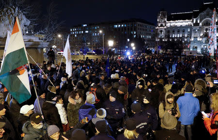 Police officers are seen among the demonstrators as they block the Chain Bridge during a protest against a proposed new labor law, billed as the "slave law", in Budapest, Hungary, January 19, 2019. REUTERS/Bernadett Szabo