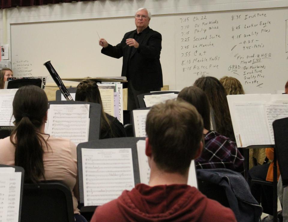 Mark Felder is shown directing the Monroe County Community College/Community Symphony Band.
