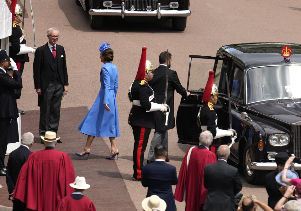 The Duchess of Cambridge wearing a Catherine Walker coat dress at the Garter Day celebrations at Windsor Castle - Credit: AP