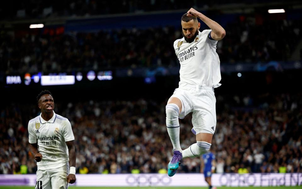 Real Madrid's Karim Benzema celebrates scoring their first goal with Vinicius Junior - Reuters/Juan Medina