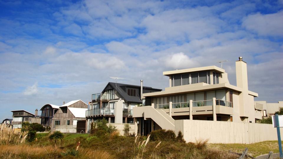 modern beach homes on a sunny day.