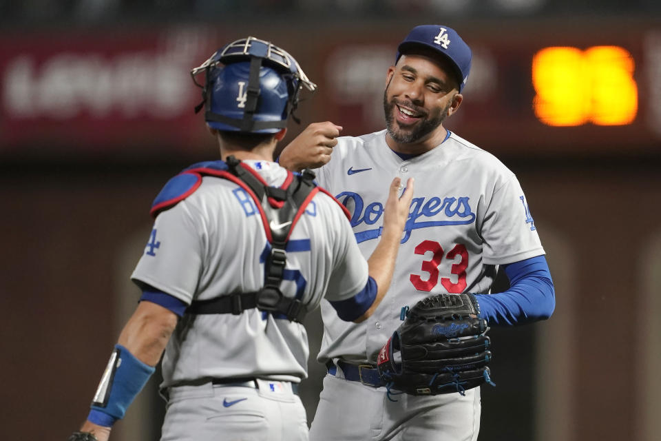 Los Angeles Dodgers pitcher David Price (33) celebrates with catcher Austin Barnes (15) after the Dodgers defeated the San Francisco Giants in a baseball game in San Francisco, Tuesday, Aug. 2, 2022. (AP Photo/Jeff Chiu)