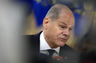 Germany's Chancellor Olaf Scholz speaks with the media as he arrives for an EU summit at the European Council building in Brussels Brussels on Thursday, Feb. 9, 2023. European Union leaders are meeting for an EU summit to discuss Ukraine and migration. (AP Photo/Virginia Mayo)