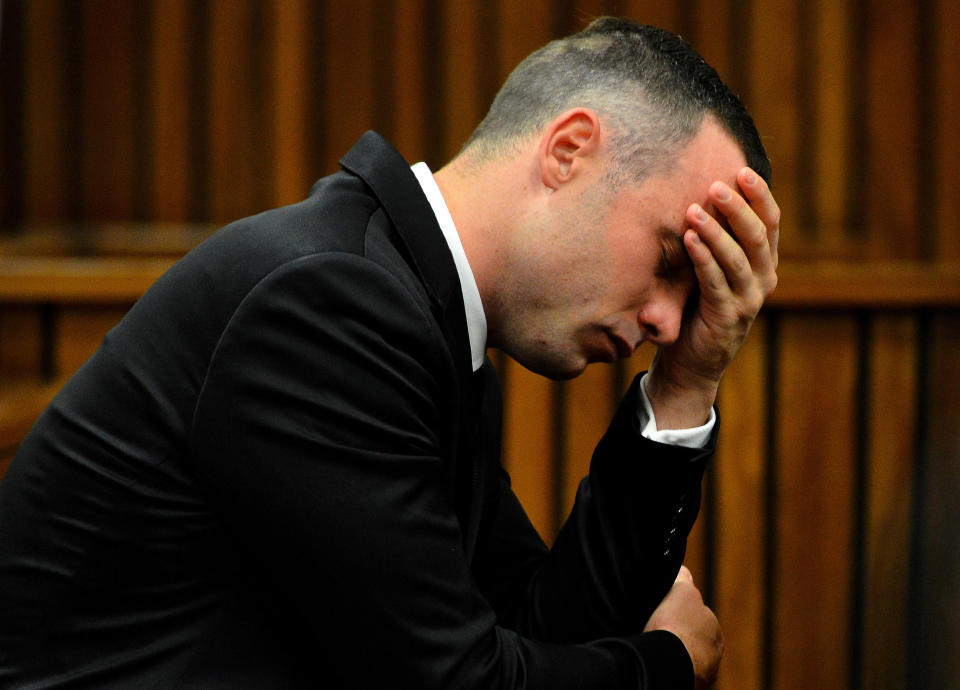 Oscar Pistorius, cradles his head in his hands during court proceedings in Pretoria, South Africa, Monday, May 5, 2014, at the resumption of his murder trial, following a two week break. Pistorius is charged with the shooting death of his girlfriend Reeva Steenkamp on Valentine's Day in 2013. (AP Photo. (AP Photo/Thobile Mathonsi, Pool)