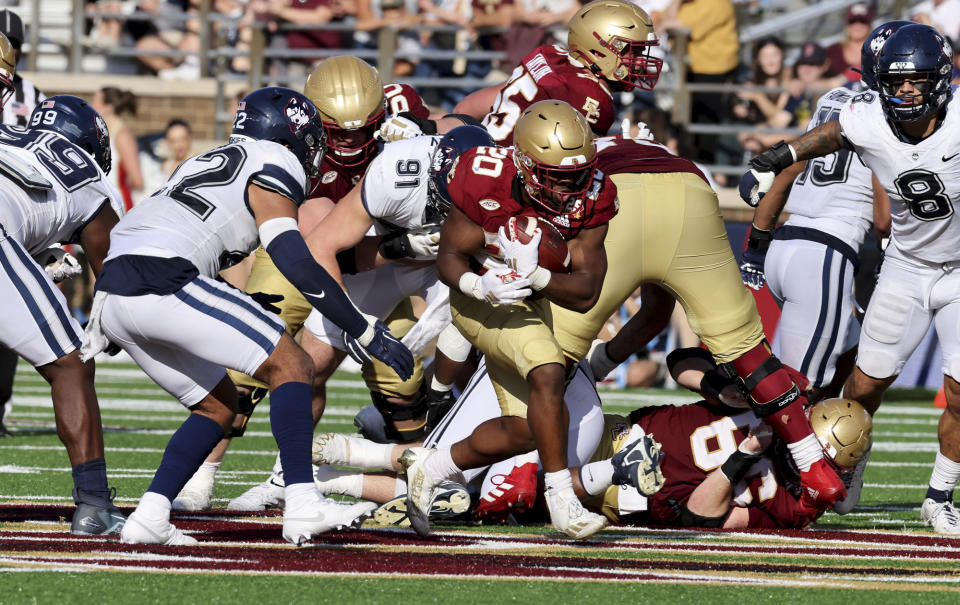 Boston College Eagles running back Alex Broome (20) runs through the UConn defense during the second half of an NCAA college football game Saturday, Oct. 28, 2023 in Boston. (AP Photo/Mark Stockwell)