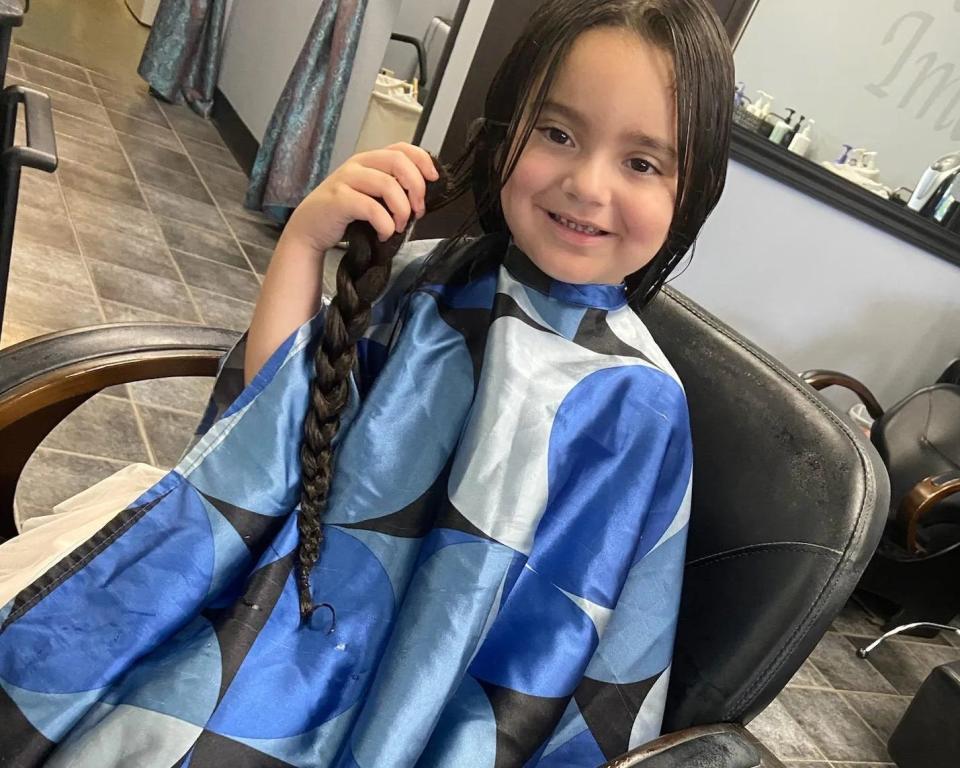 Ayla Robles, 5, is following in her family's 24-year-old tradition of donating hair to the Locks of Love Foundation, on Aug. 11, 2023.