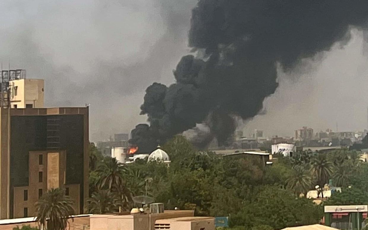 Smoke billows above residential buildings in Khartoum