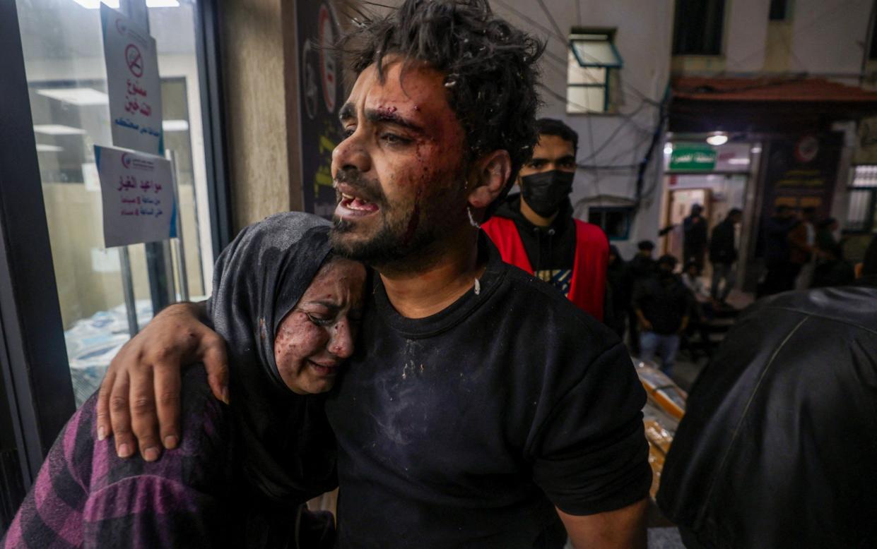 Victims of an Israeli army strike react outside of Kuwait hospital in Rafah